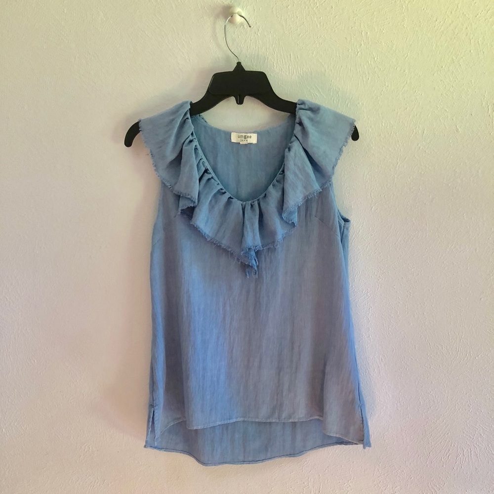 Denim ruffle top. Very good pre owned condition.